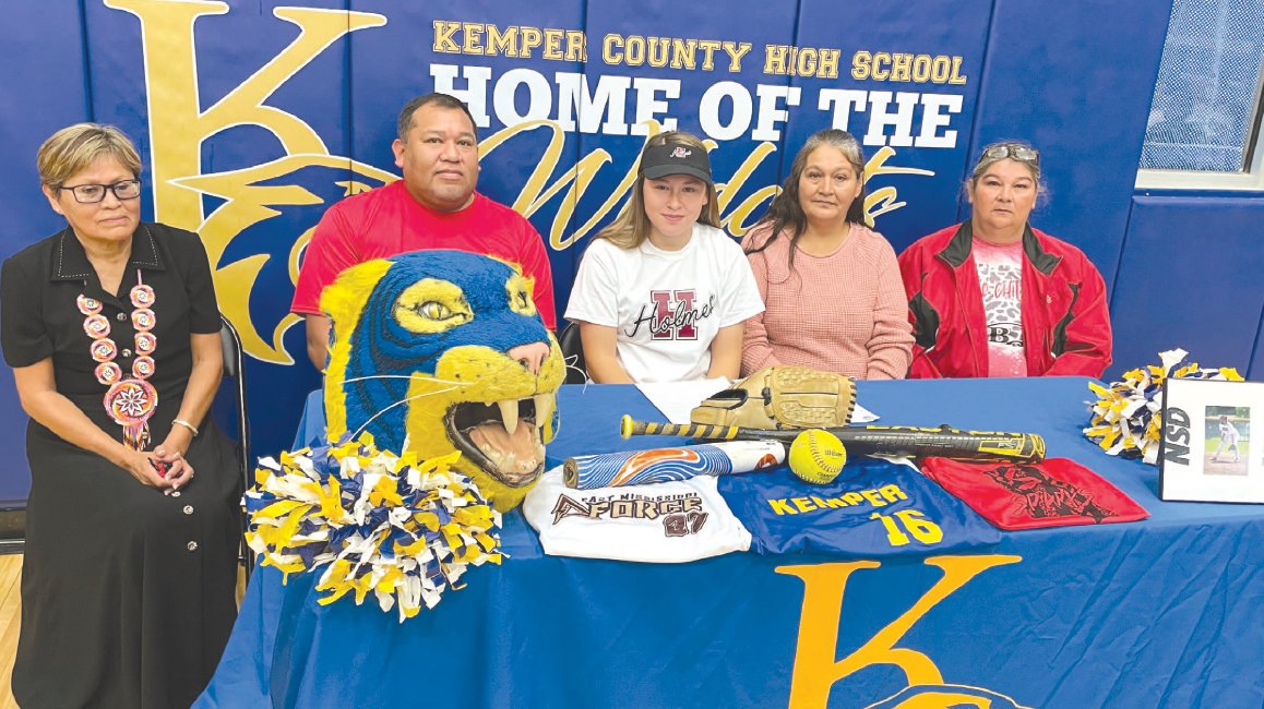 Kemper County High School senior Neera Bell signed a softball scholarship with Holmes Community College on Wednesday morning. Pictured are: from left to right, Ruthie Bell, grandmother; Gabriel Bell, father; Neera Bell; Susan Steve, mother; and Magda Bell, aunt.